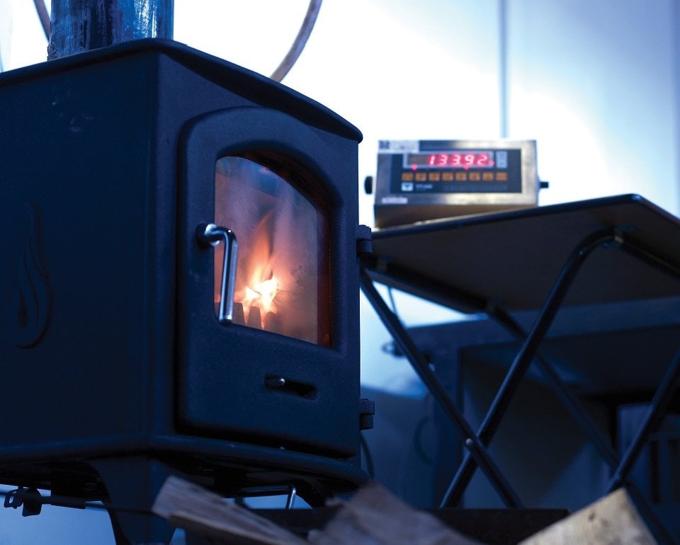 Furnace with a burning solid fuel inside